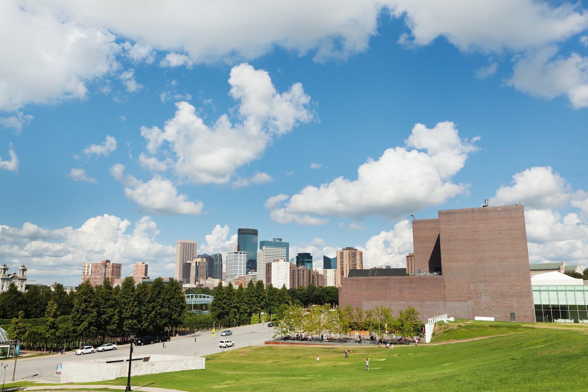 Subject: Downtown Minneapolis skyline with the Walker Art Center and the Minneapolis Sculpture Garden in the foreground.