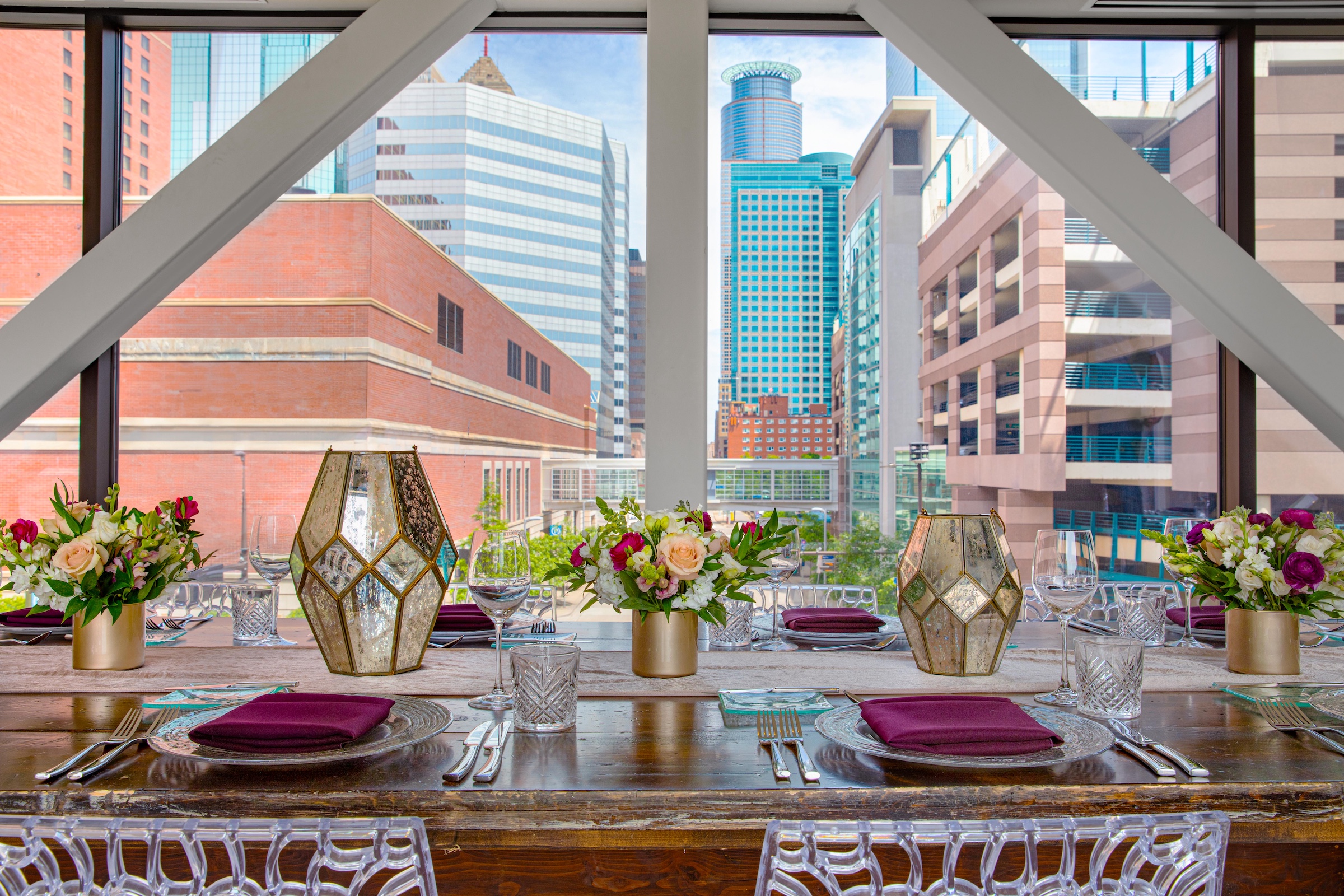 A sophisticated dining settings on a wooden table from Skyway venue at Hotel Ivy