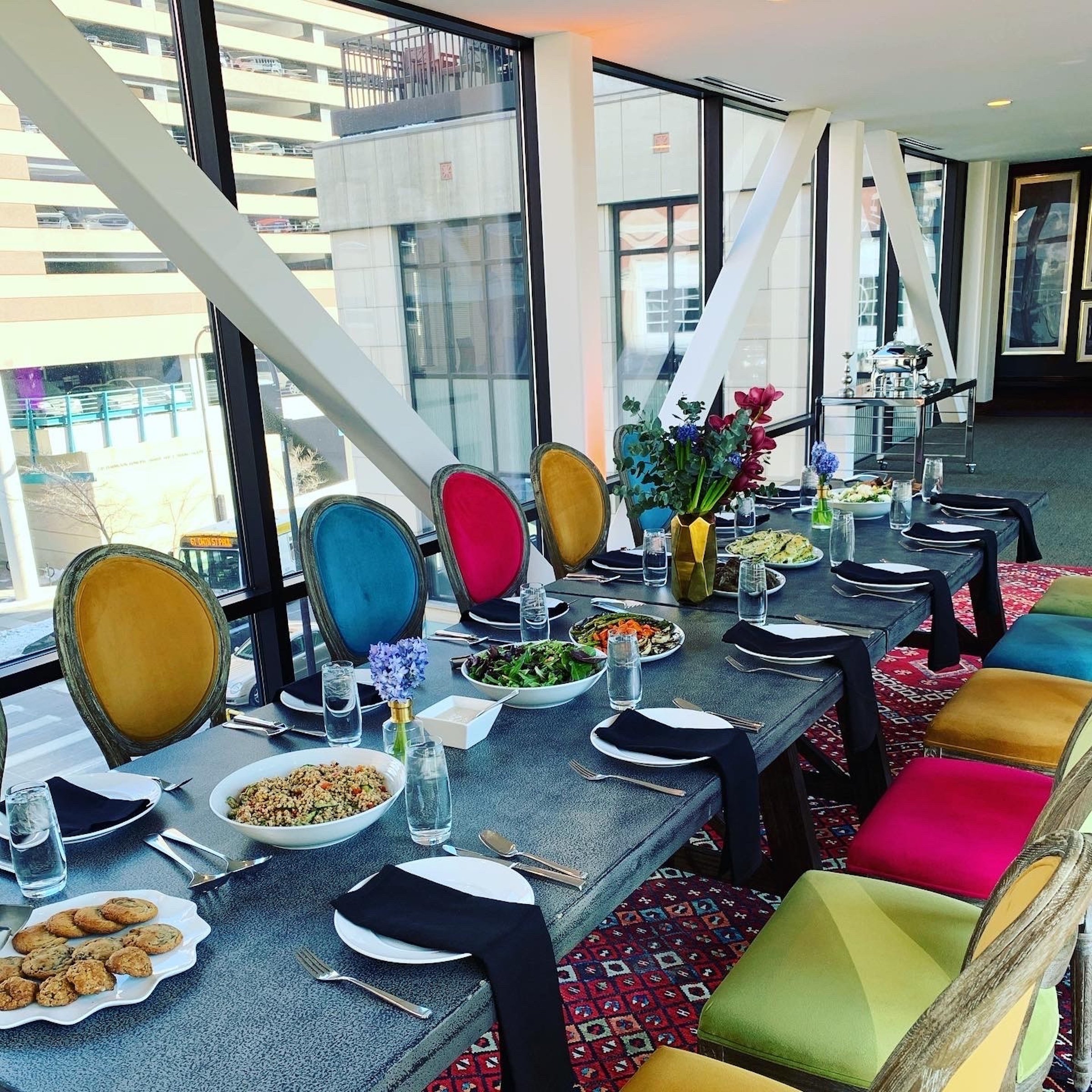 Colourful lunch event settings at Skyway venue from Hotel Ivy