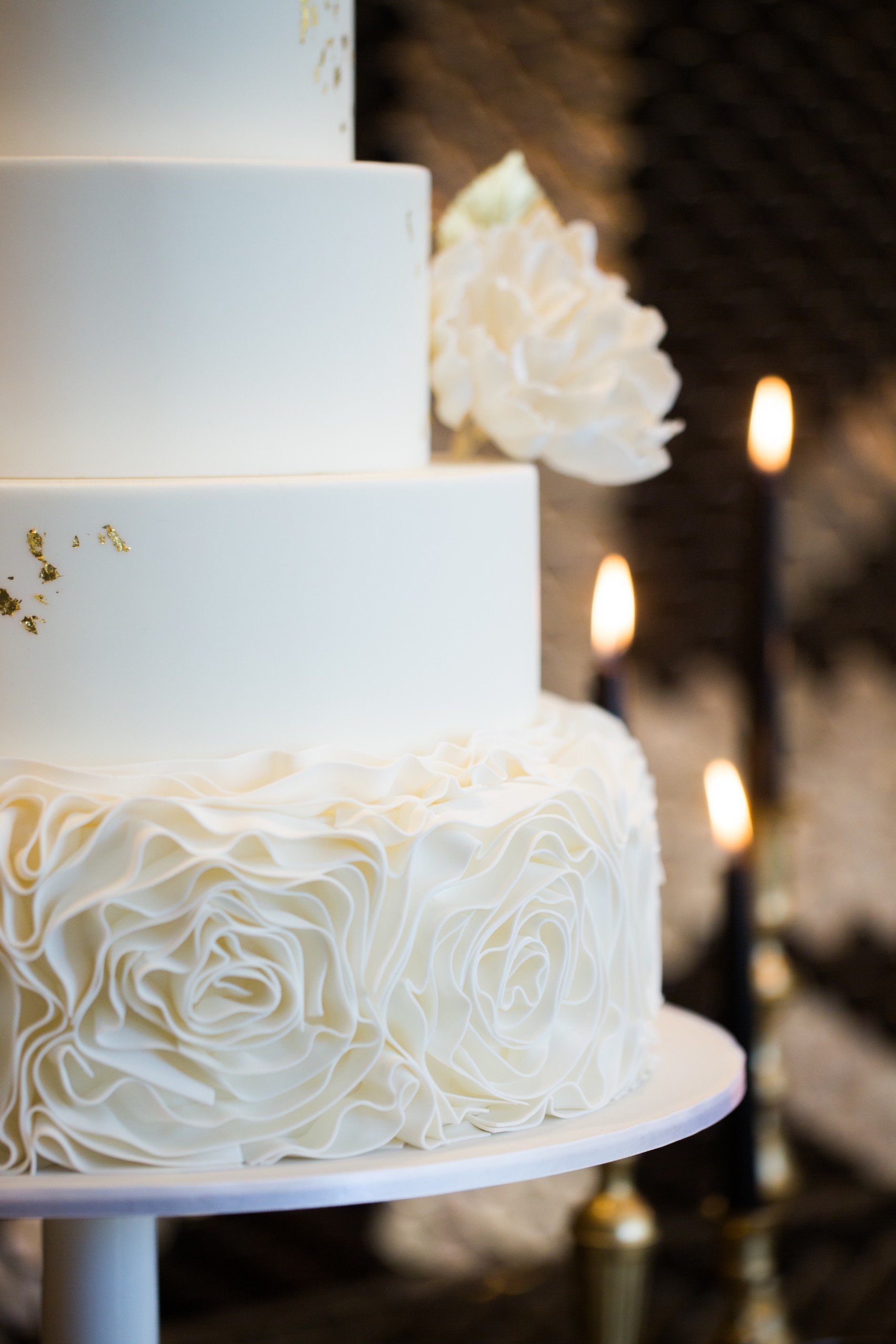 Three layer whipped cream wedding cake with white rose