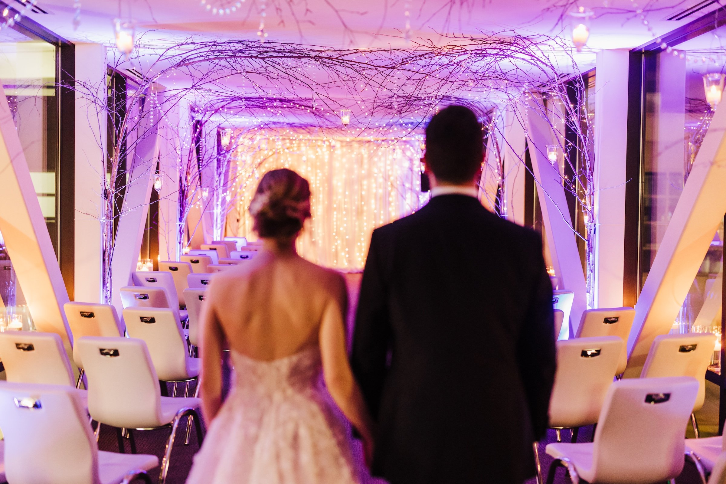 Granby & Sprung's wedding - Couple photo in the purple lighting venue