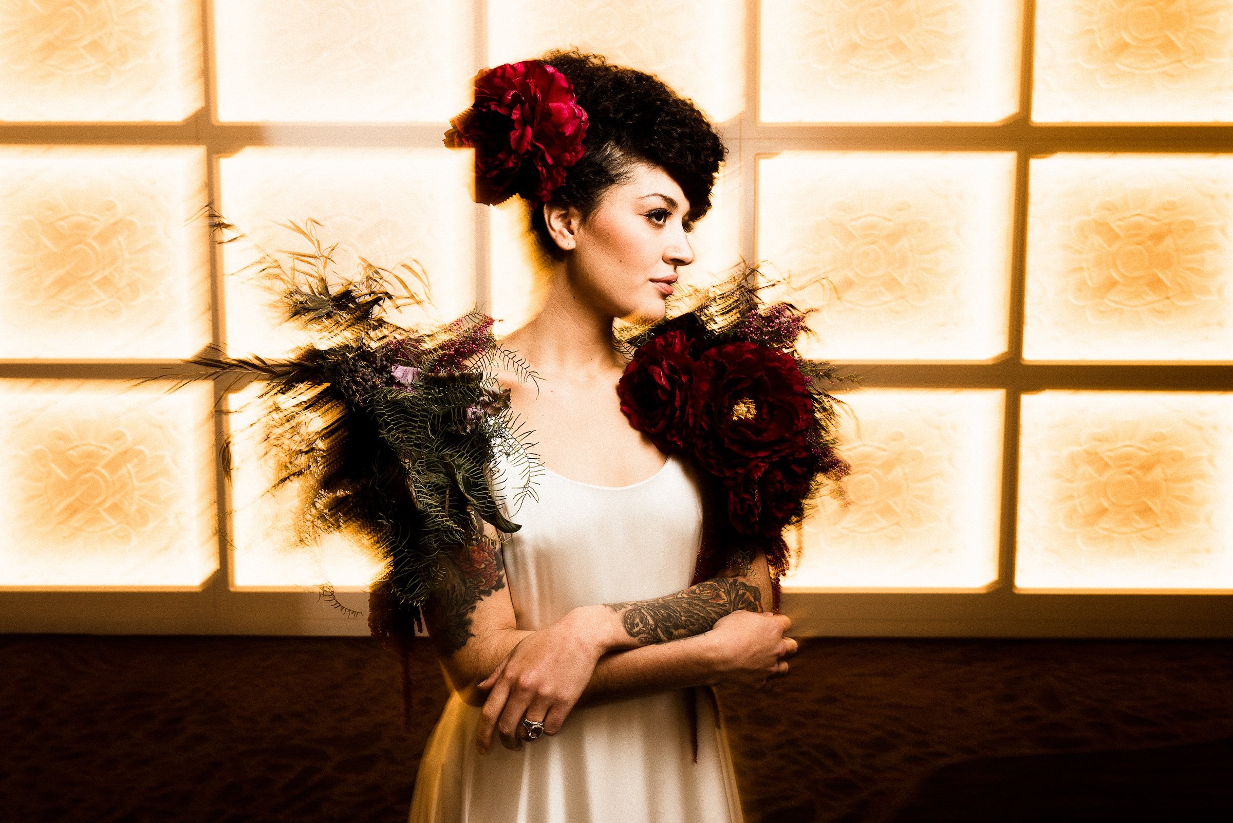 A blurred photoshoot of a gorgeous bride with flower decorations on her