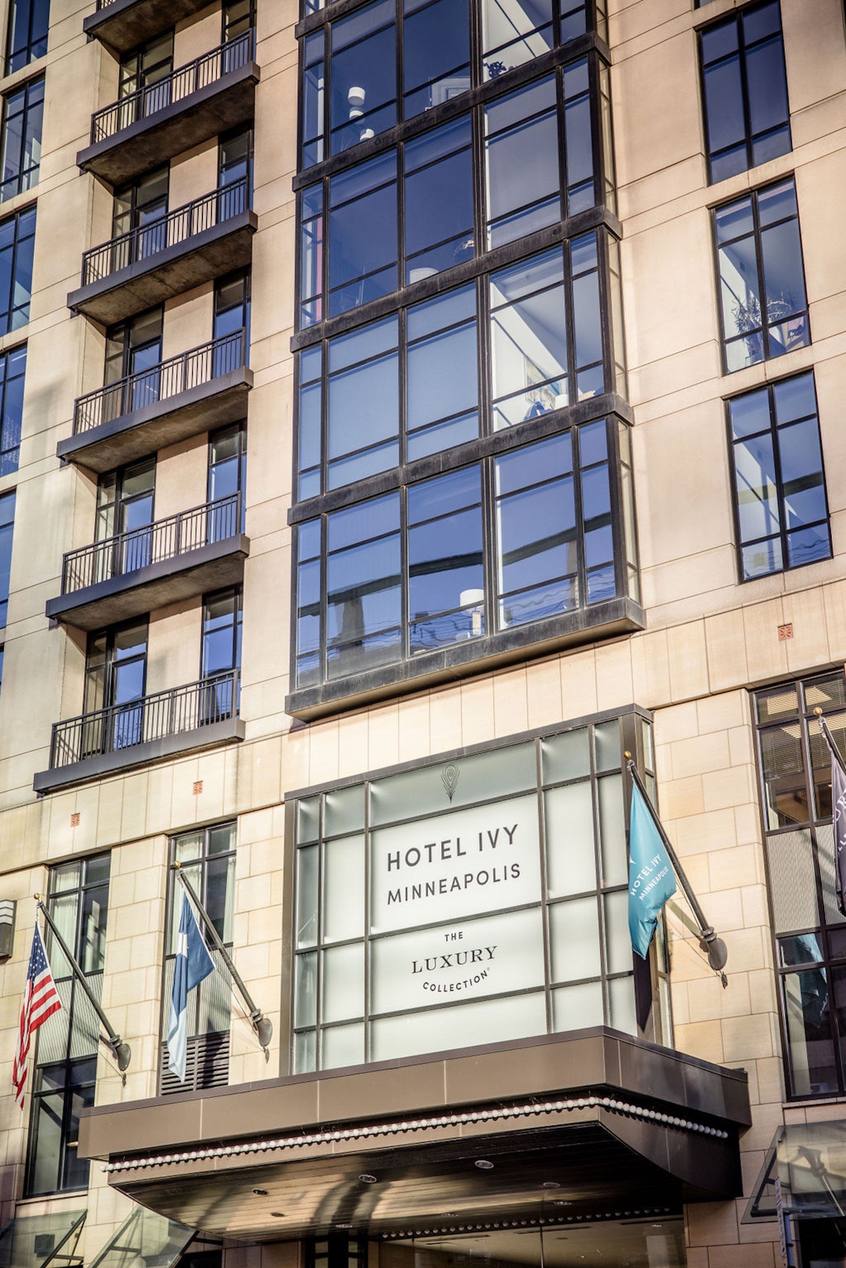 Hotel Ivy logo at the entrance with flags