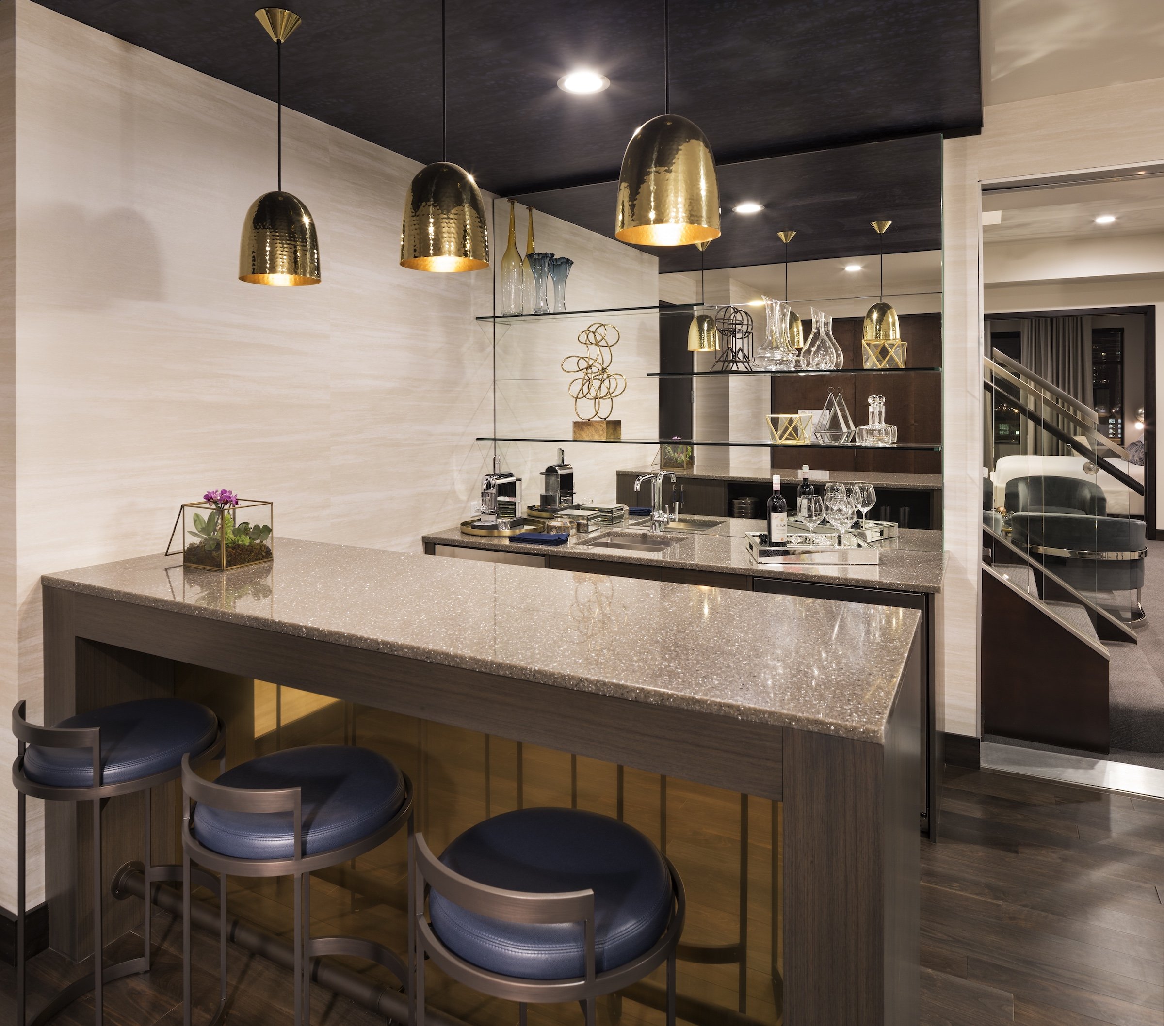 A Kitchen area with high dining tables at Penthouse Suite of Hotel Ivy